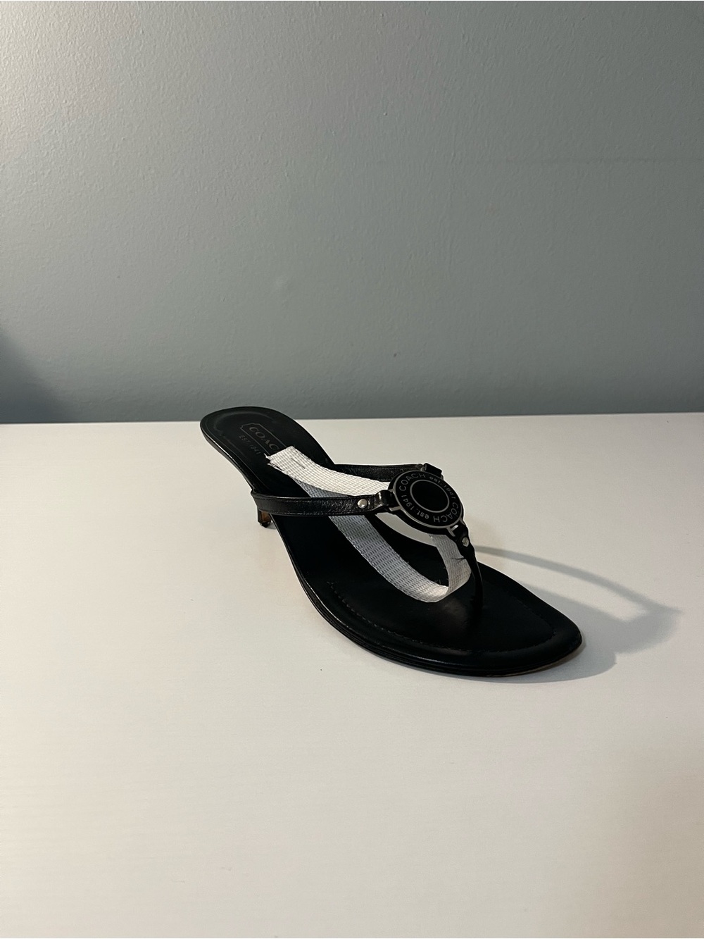 Coach Black Leather Thong Sandals with Logo Medallion
